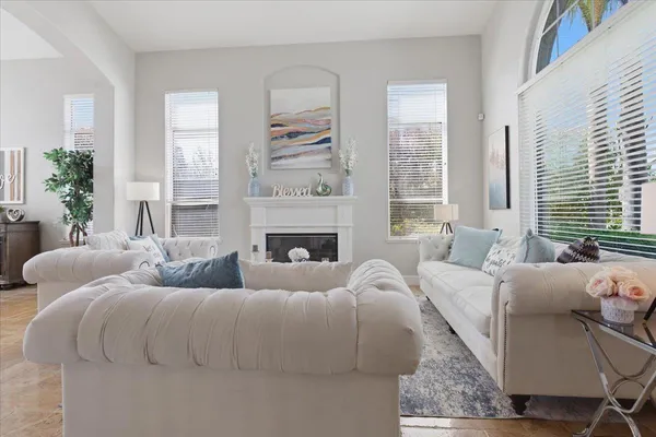 a living room with furniture and a large window
