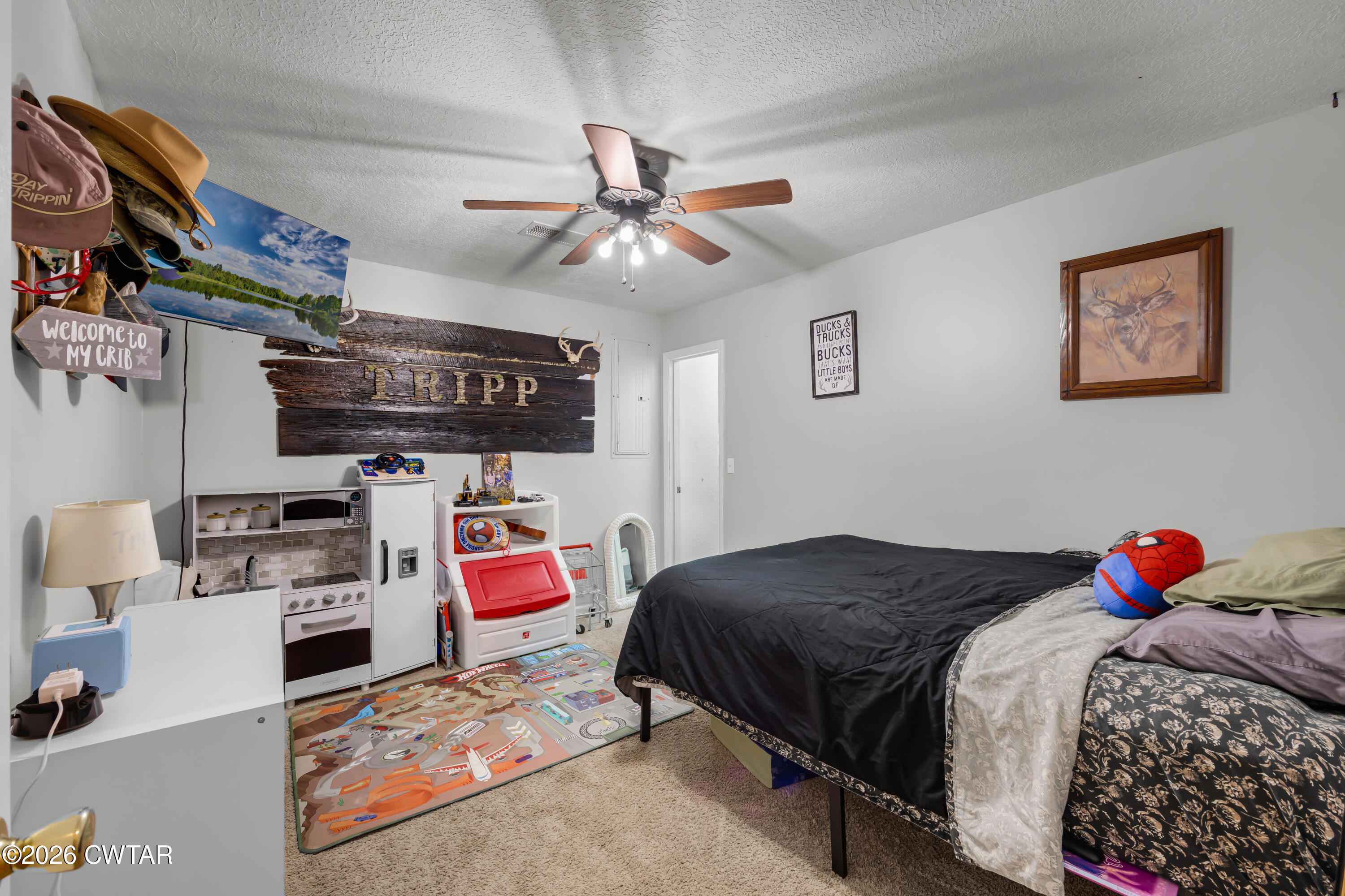 67 Robert Crocker Road Bradford, TN 38316 - Photo 11 of 20 a bedroom with a bed and wooden floor