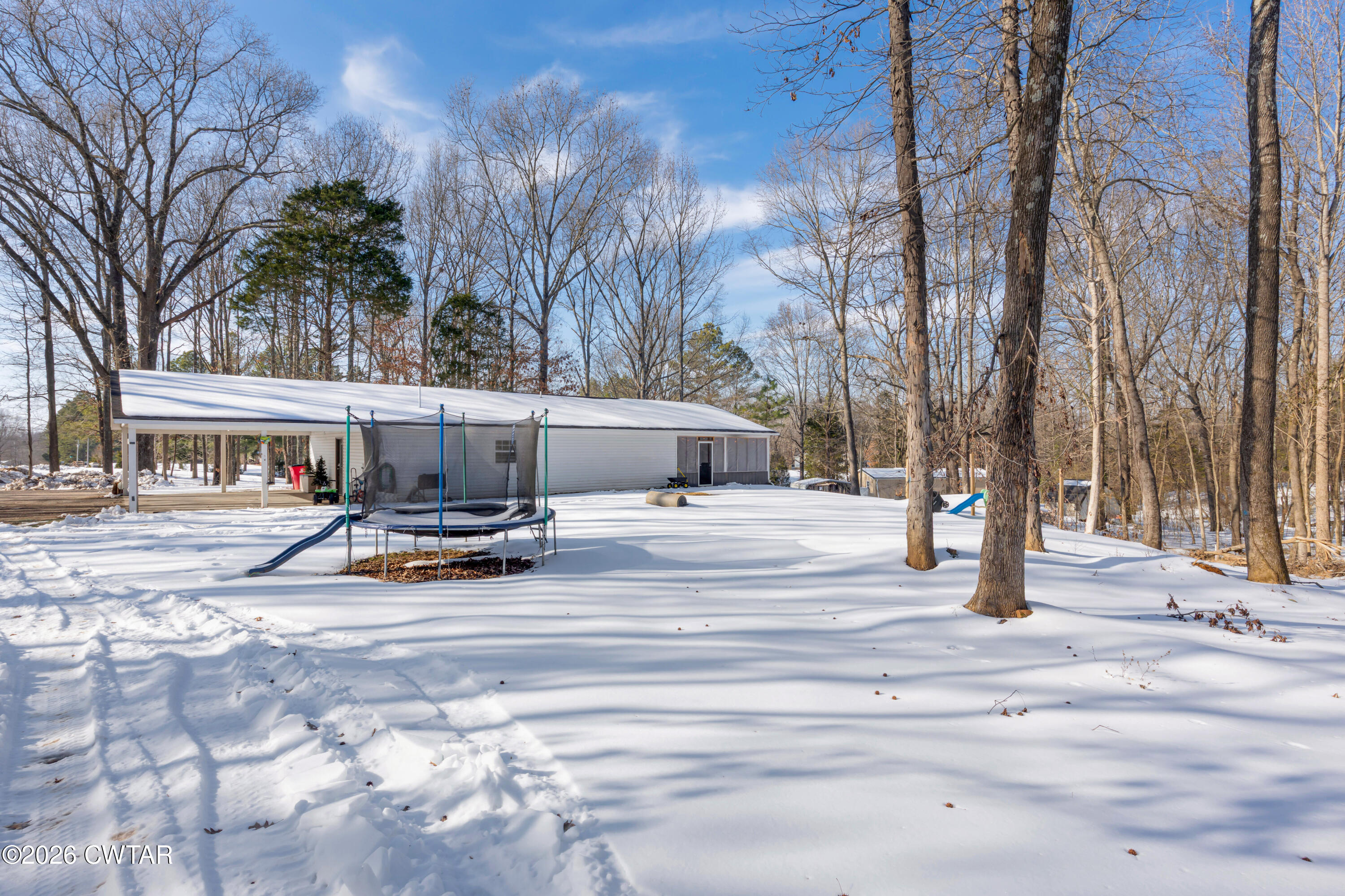 67 Robert Crocker Road Bradford, TN 38316 - Photo 17 of 20 a view of street with trees and cars