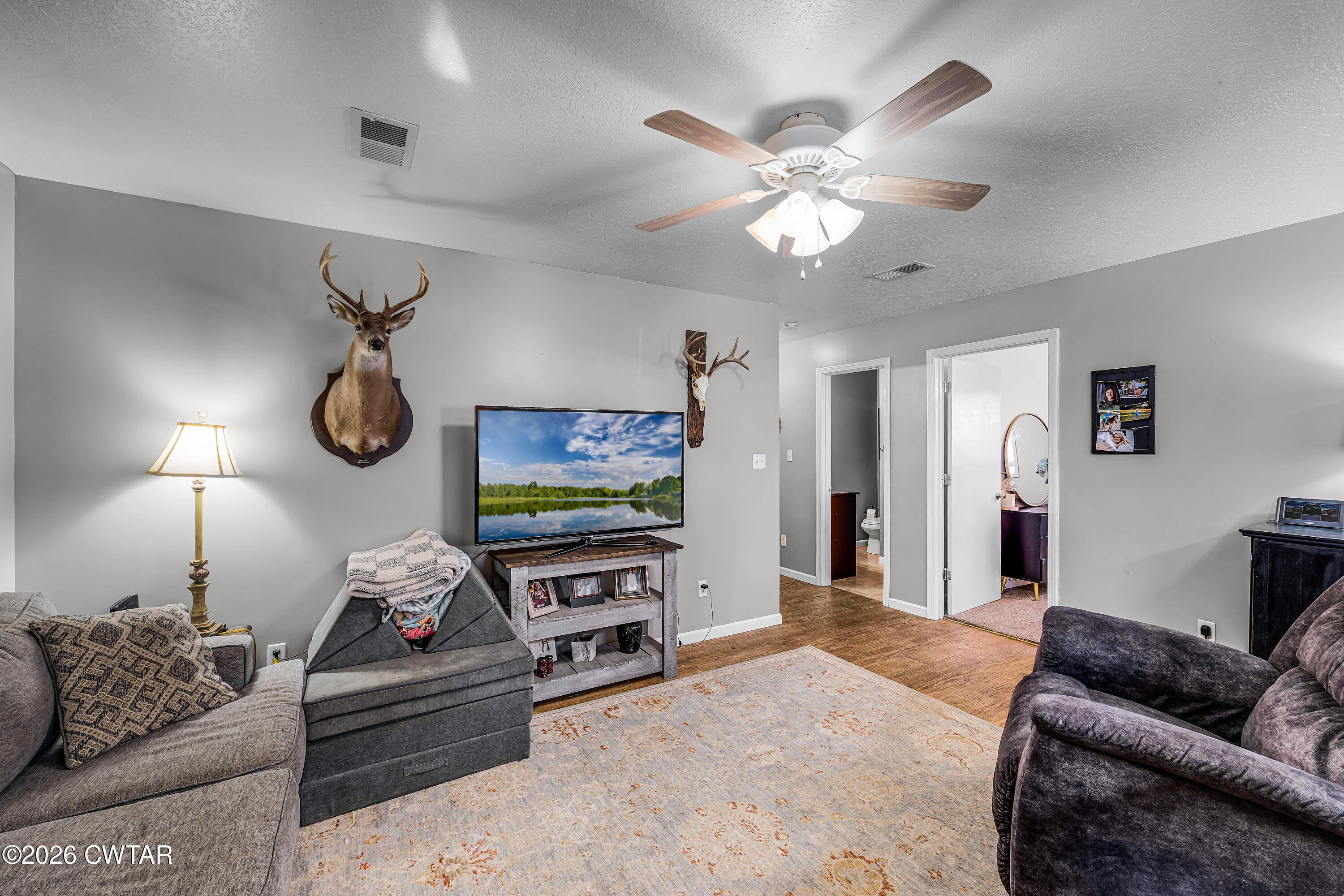67 Robert Crocker Road Bradford, TN 38316 - Photo 3 of 20 a living room with furniture a ceiling fan and a window
