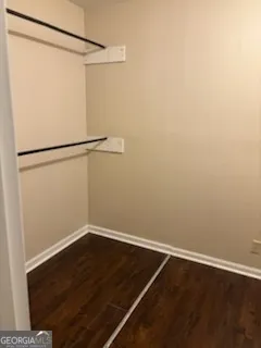 a view of a room with wooden floor