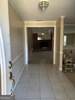 a view of a livingroom with furniture and staircase