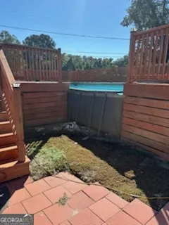 a view of a backyard with sitting area