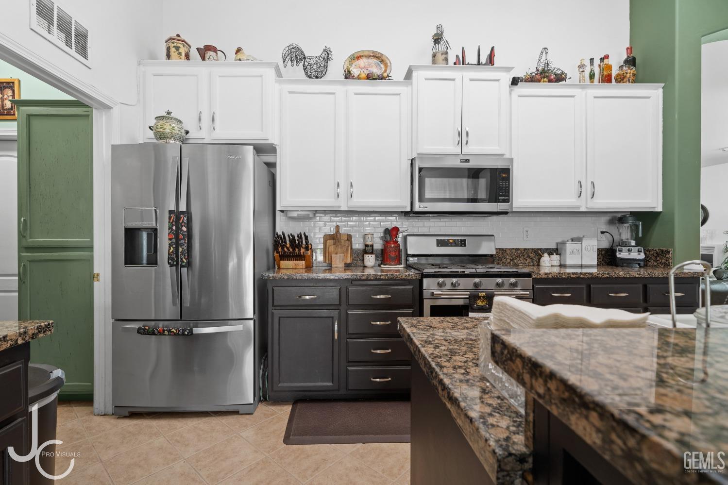 Undisclosed Address Bakersfield, CA 93312 - Photo 14 of 46 a kitchen with stainless steel appliances granite countertop a refrigerator a stove and a sink