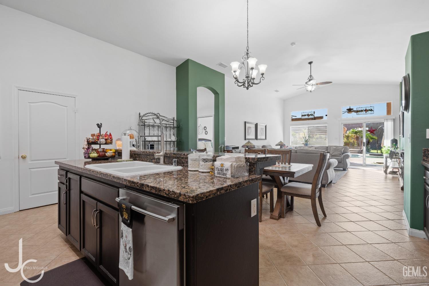 Undisclosed Address Bakersfield, CA 93312 - Photo 15 of 46 a view of a dining room with furniture and a chandelier