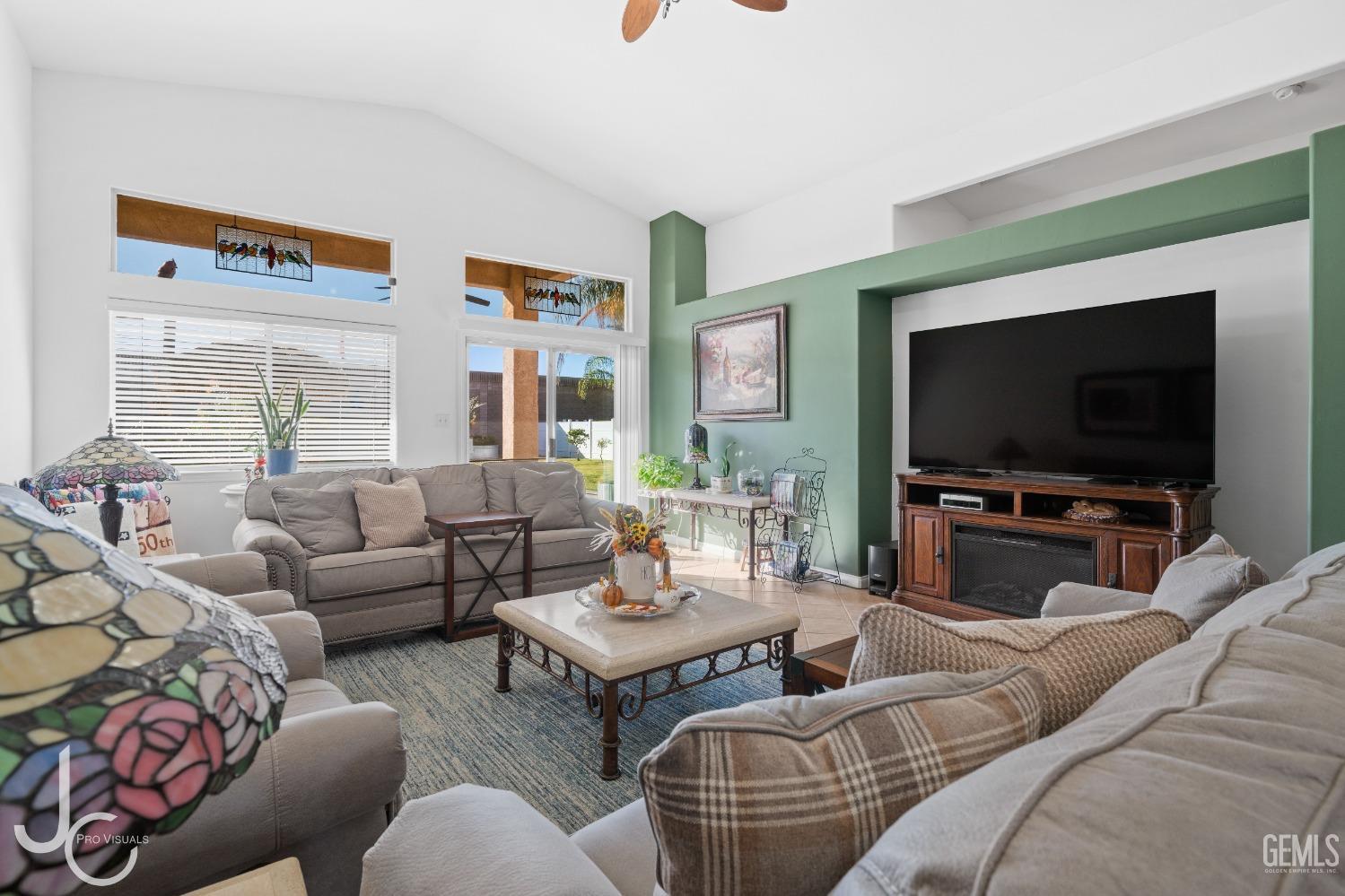 Undisclosed Address Bakersfield, CA 93312 - Photo 17 of 46 a living room with furniture and a flat screen tv