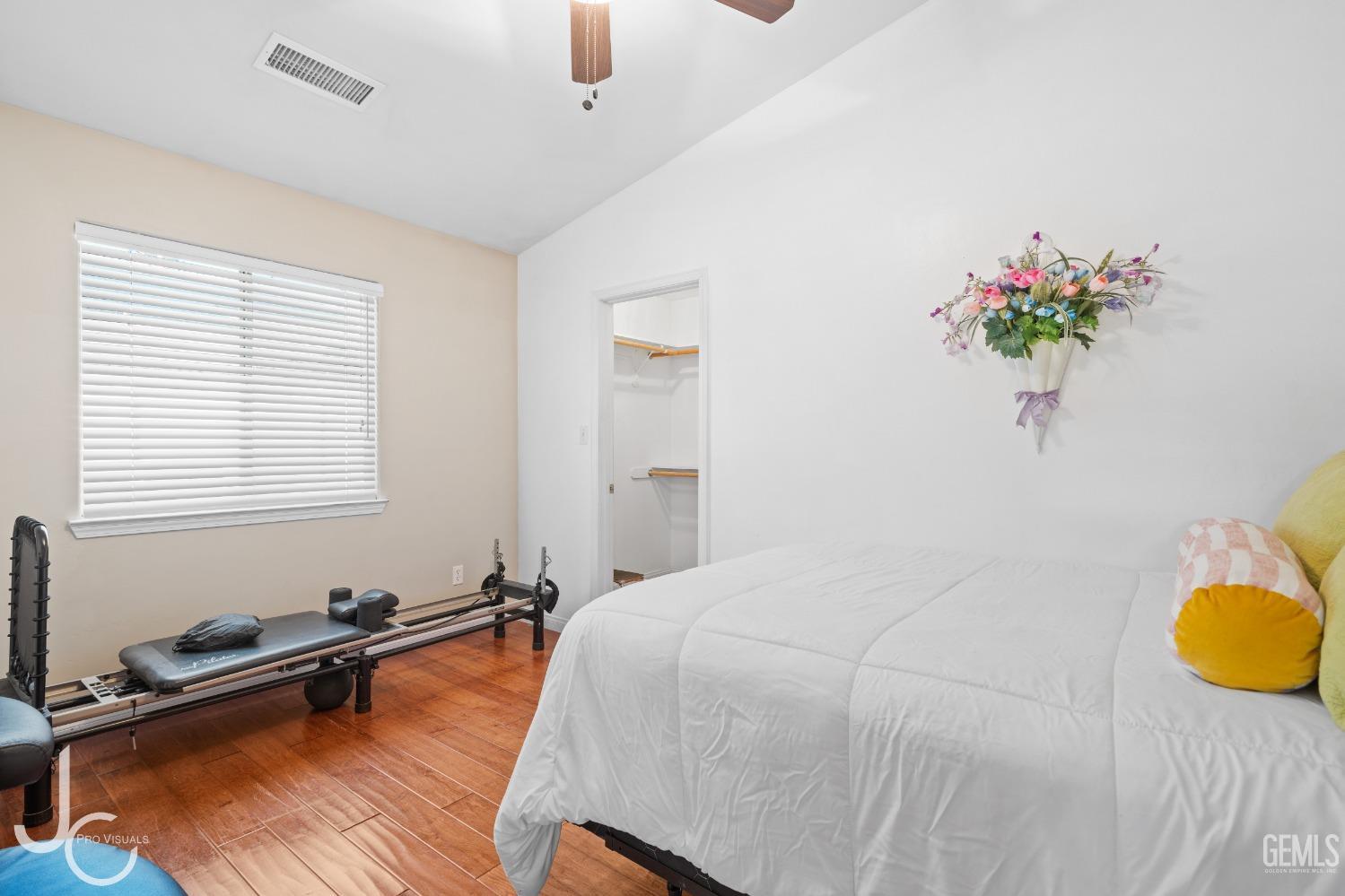 Undisclosed Address Bakersfield, CA 93312 - Photo 19 of 46 a bedroom with a bed and a dresser
