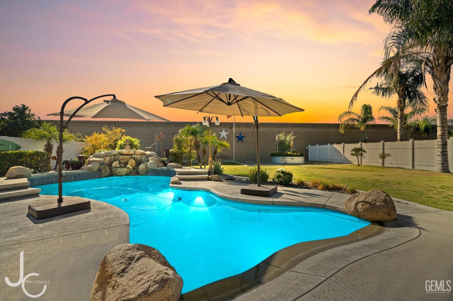 Undisclosed Address Bakersfield, CA 93312 - Photo 2 of 46 a view of a swimming pool with lounge chairs