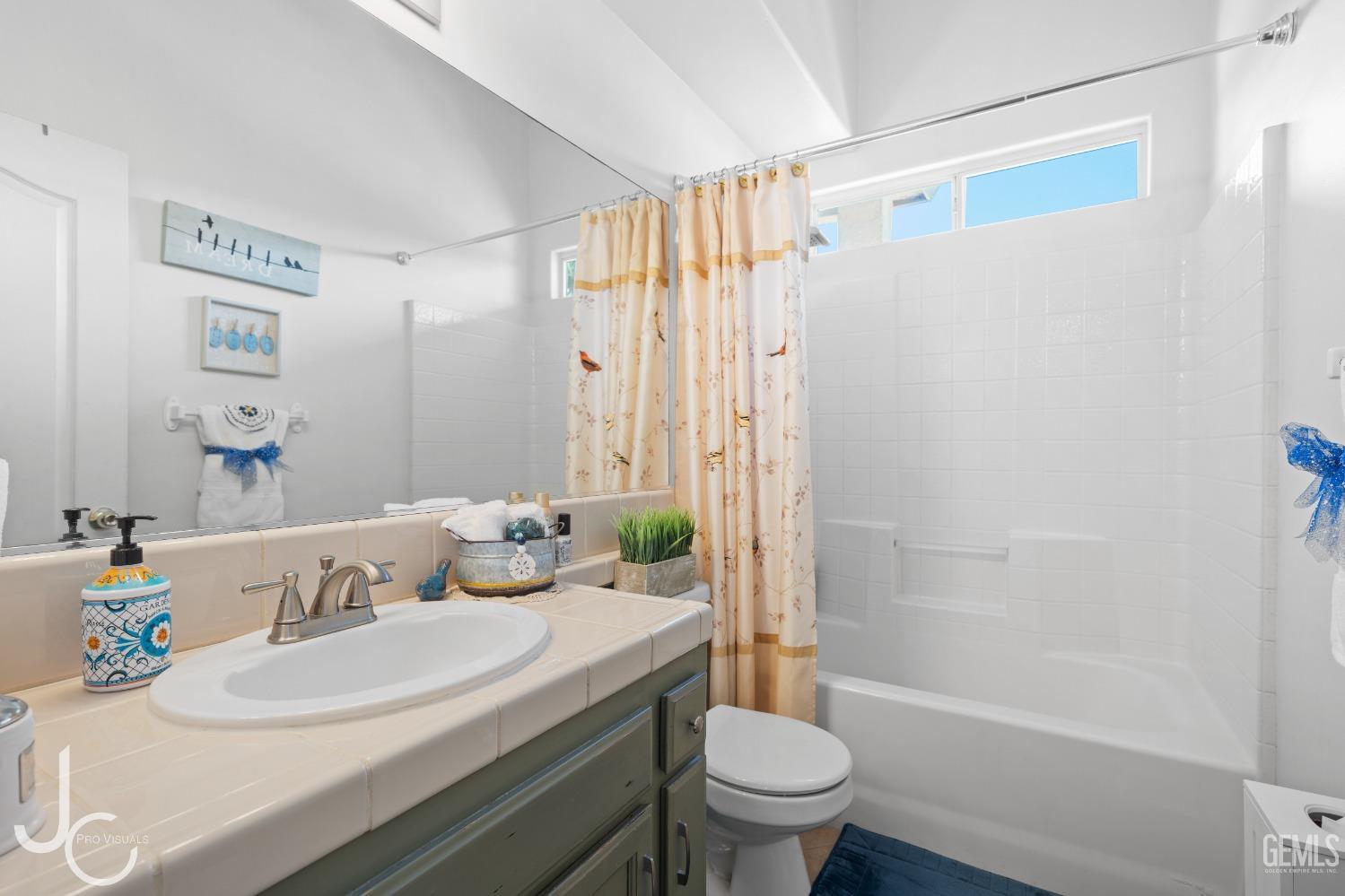 Undisclosed Address Bakersfield, CA 93312 - Photo 22 of 46 a bathroom with a sink toilet and shower