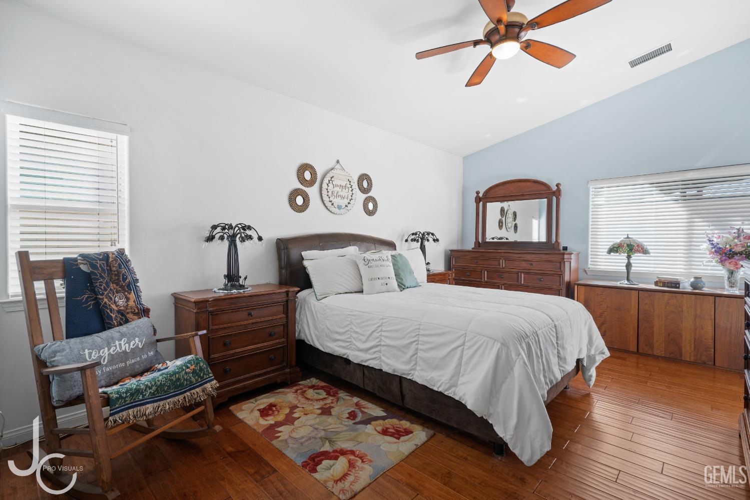 Undisclosed Address Bakersfield, CA 93312 - Photo 24 of 46 a bedroom with a bed and wooden floor