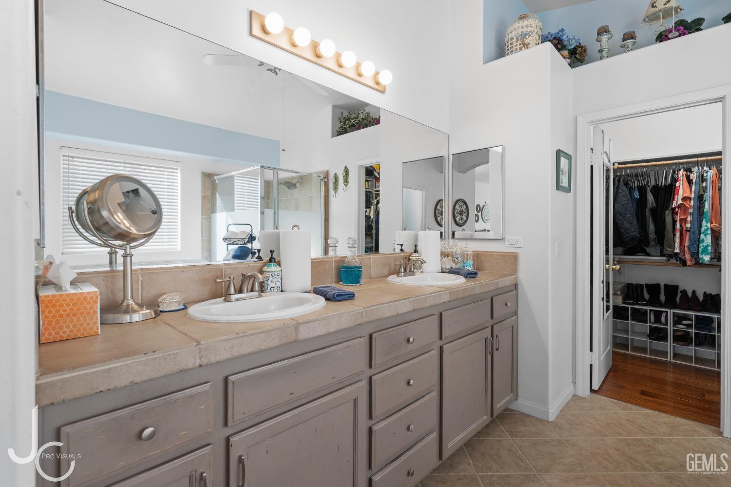Undisclosed Address Bakersfield, CA 93312 - Photo 27 of 46 a bathroom with a granite countertop sink mirror and vanity