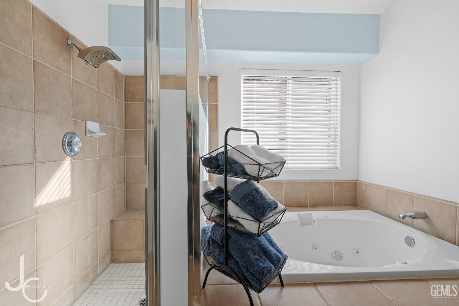 Undisclosed Address Bakersfield, CA 93312 - Photo 28 of 46 a bathroom with a bathtub