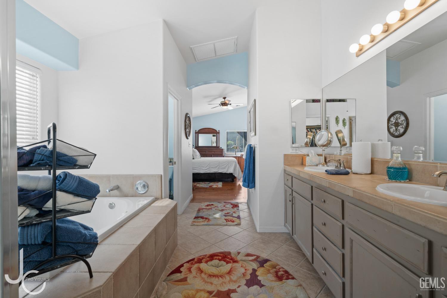 Undisclosed Address Bakersfield, CA 93312 - Photo 30 of 46 a very nice looking room with a large mirror and sink