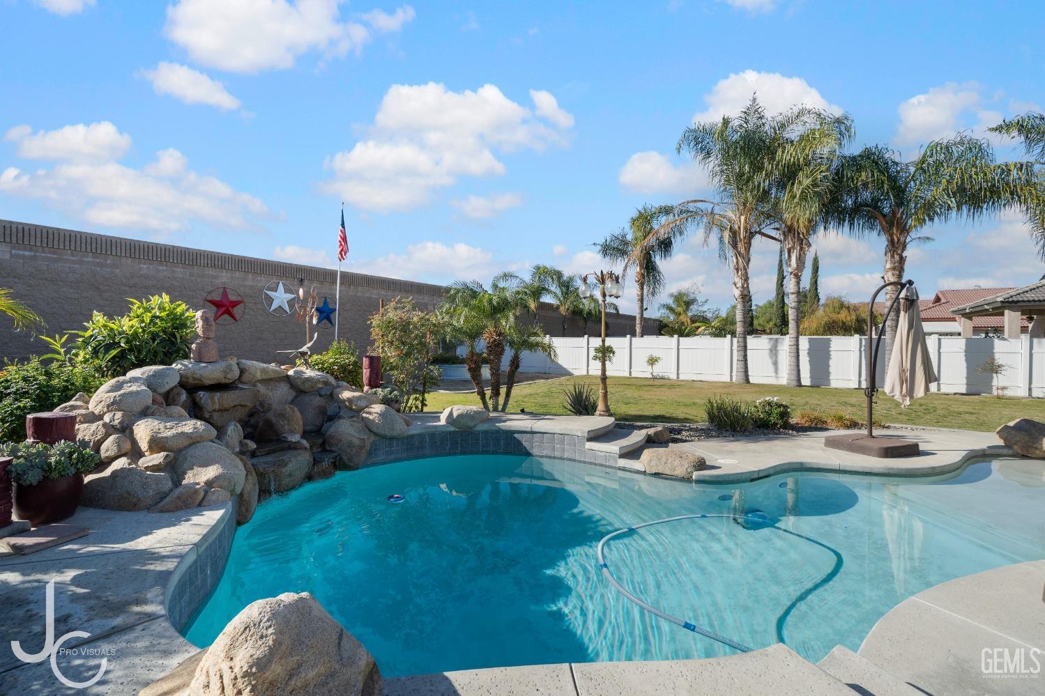Undisclosed Address Bakersfield, CA 93312 - Photo 34 of 46 a view of a swimming pool with a patio