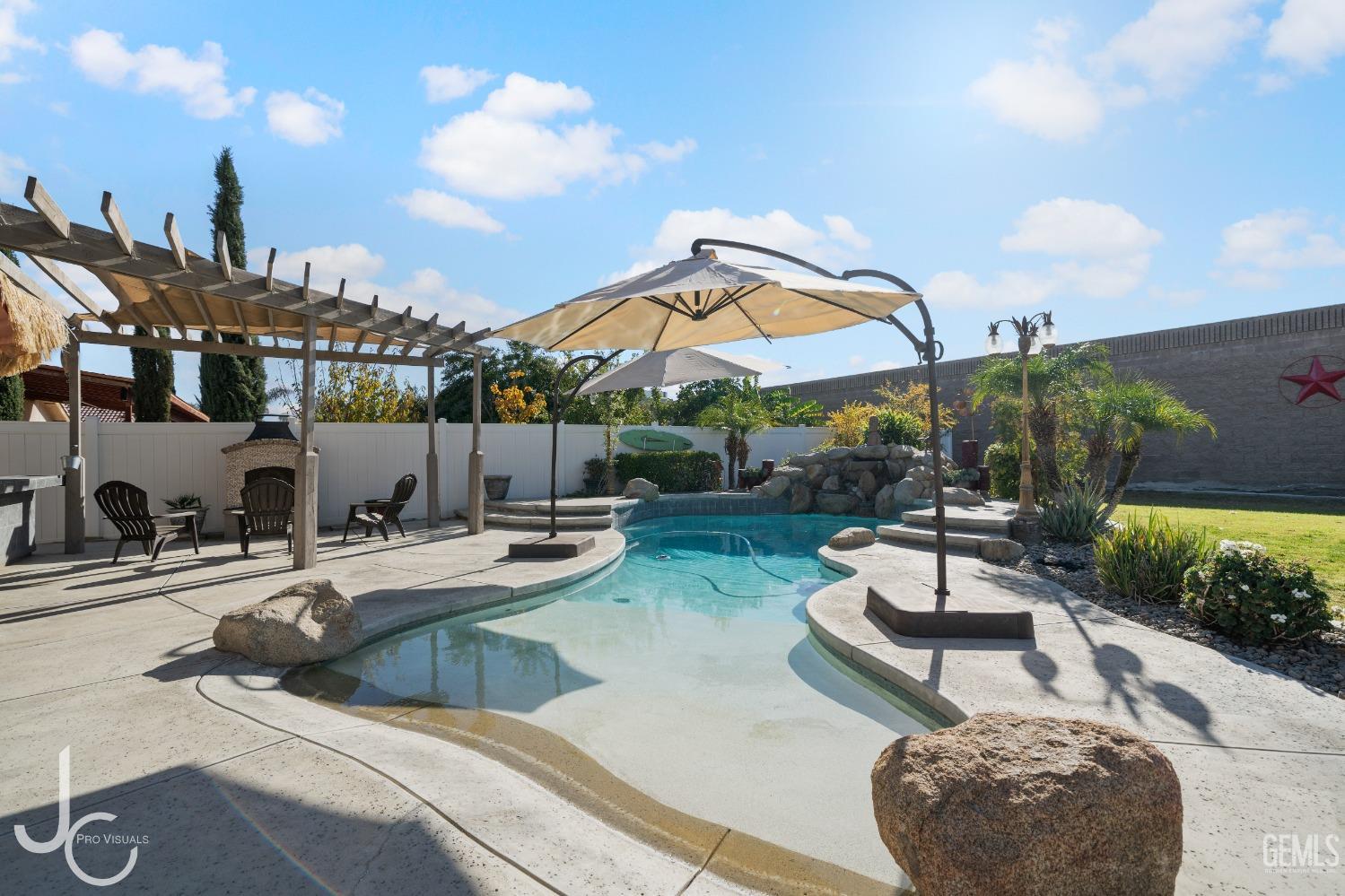 Undisclosed Address Bakersfield, CA 93312 - Photo 39 of 46 a view of a patio with swimming pool table and chairs