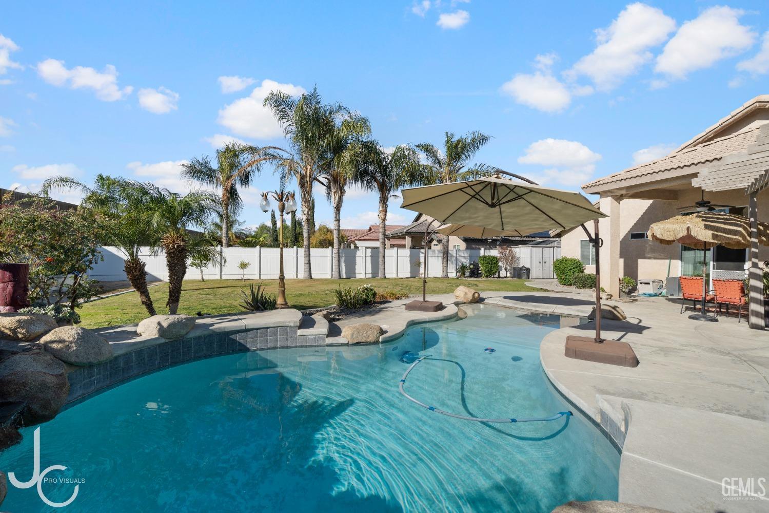 Undisclosed Address Bakersfield, CA 93312 - Photo 41 of 46 a view of a swimming pool with lounge chairs
