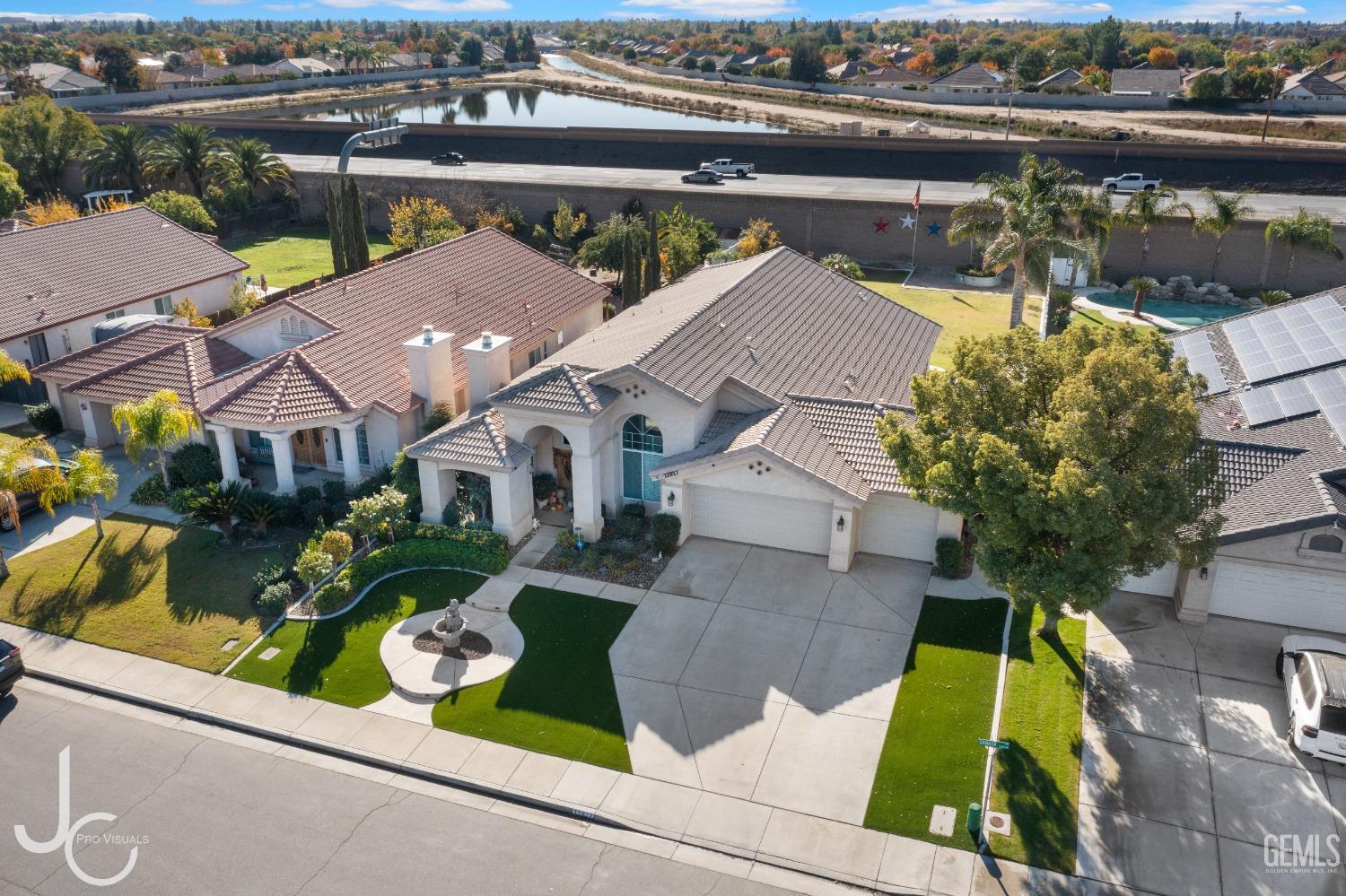 Undisclosed Address Bakersfield, CA 93312 - Photo 43 of 46 an aerial view of residential houses with outdoor space and parking