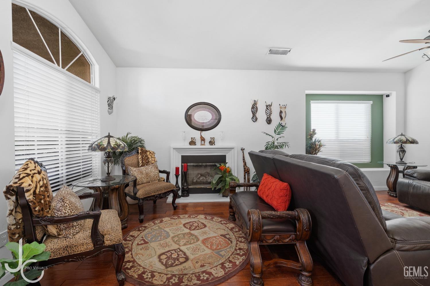 Undisclosed Address Bakersfield, CA 93312 - Photo 5 of 46 a living room with furniture and wooden floor