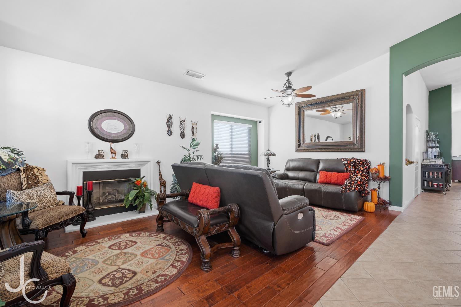 Undisclosed Address Bakersfield, CA 93312 - Photo 6 of 46 a living room with furniture and a fireplace