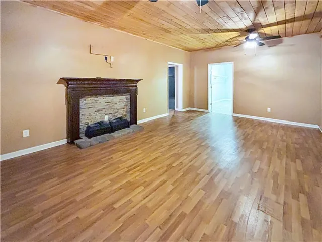 a kitchen with a stove a sink and a microwave