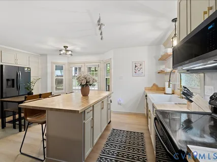 a kitchen with sink cabinets and stove