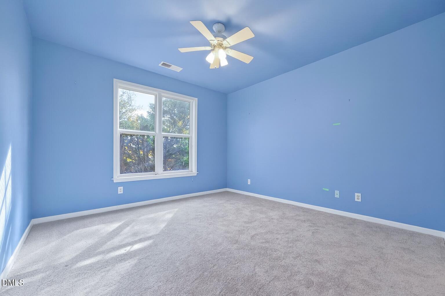 1721 Tiffany Bay Court, Unit 204 Raleigh, NC 27609 - Photo 19 of 29 Sunny Sky Blue Bedroom with Trees
