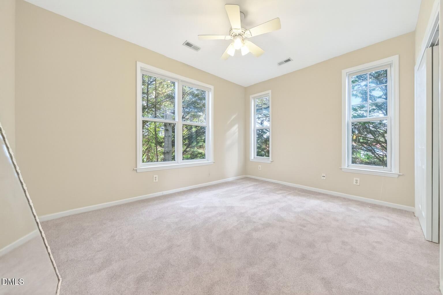 1721 Tiffany Bay Court, Unit 204 Raleigh, NC 27609 - Photo 26 of 29 Tranquil Bedroom with Forest View