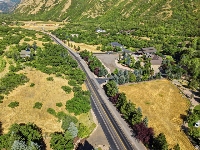 441 South 2080th Street East Springville, UT 84663 - Photo 57 of 64 Expansive elevated property featuring a paved road frontage, mature landscaping, and a mountainous backdrop