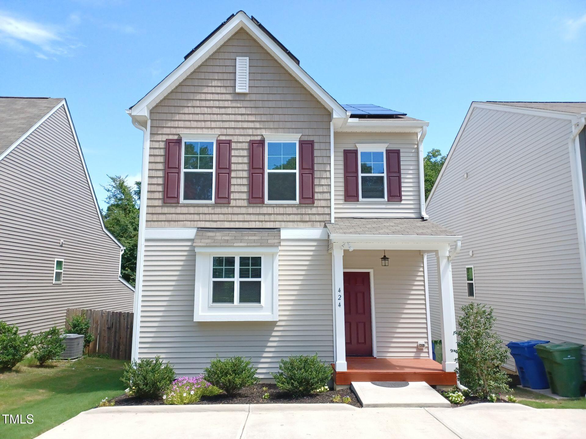 a front view of a house with garden