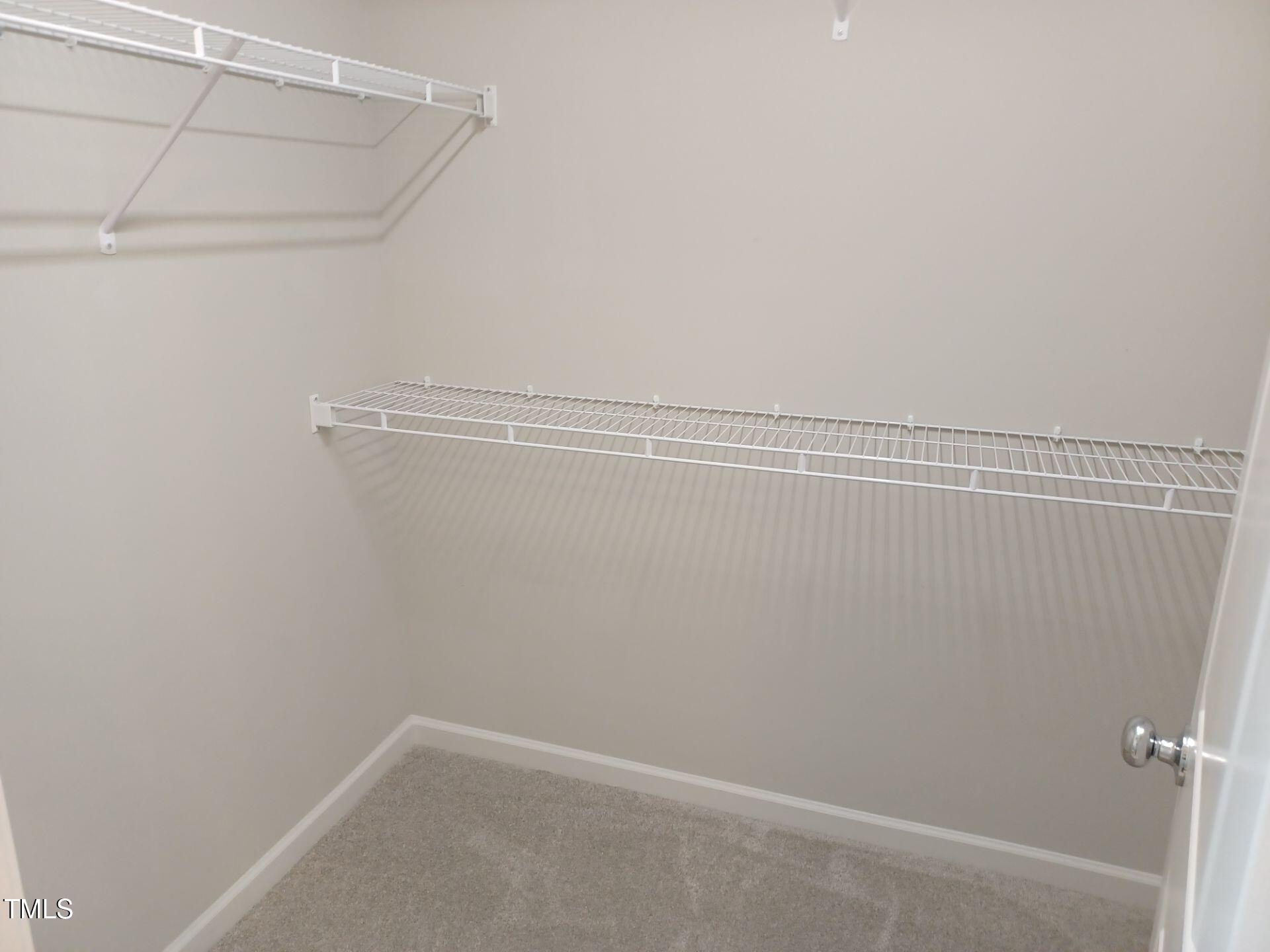 424 Cherry Street Fuquay-Varina, NC 27526 - Photo 16 of 28 a view of a room with racks on the wall