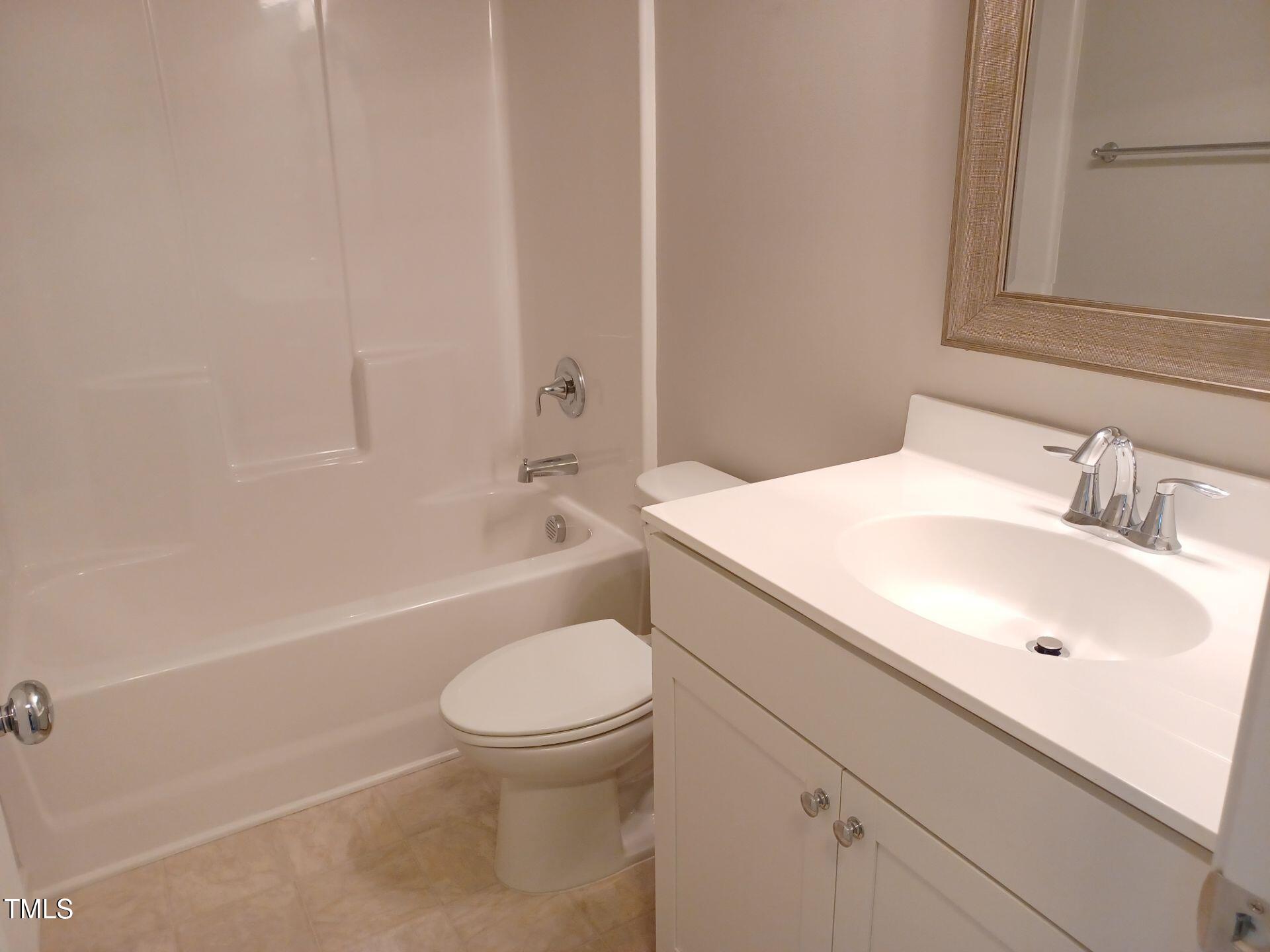 424 Cherry Street Fuquay-Varina, NC 27526 - Photo 20 of 28 a bathroom with a sink toilet and shower