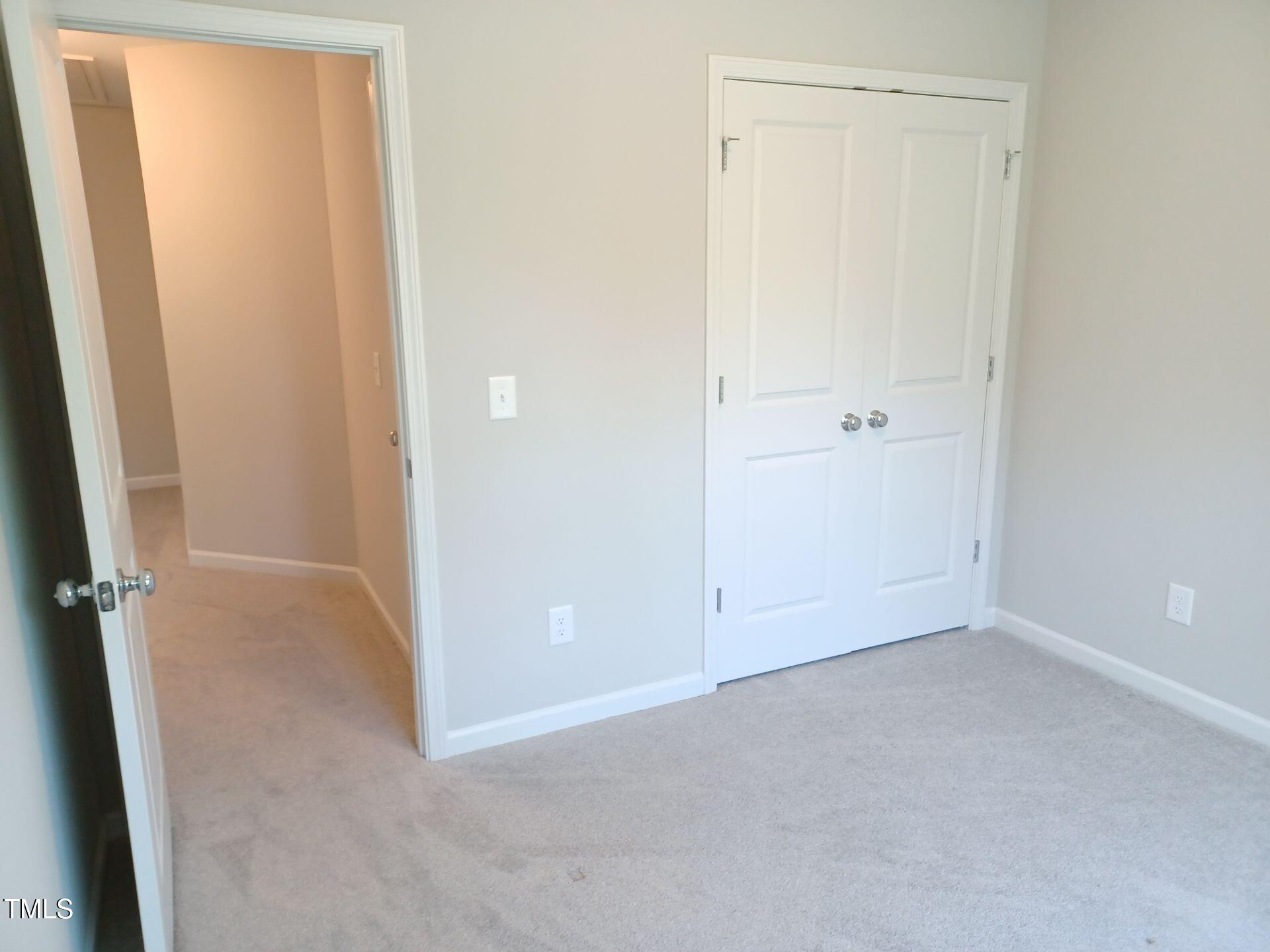 424 Cherry Street Fuquay-Varina, NC 27526 - Photo 22 of 28 an empty room with windows