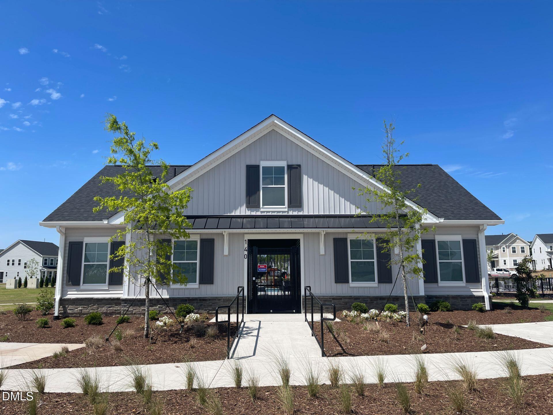 424 Cherry Street Fuquay-Varina, NC 27526 - Photo 24 of 28 a front view of a house with garden