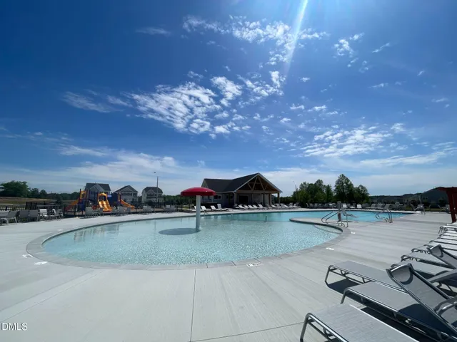 a view of a swimming pool and a chairs