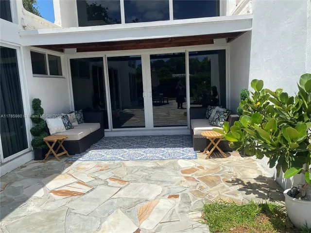 a view of a lounge chairs in a patio