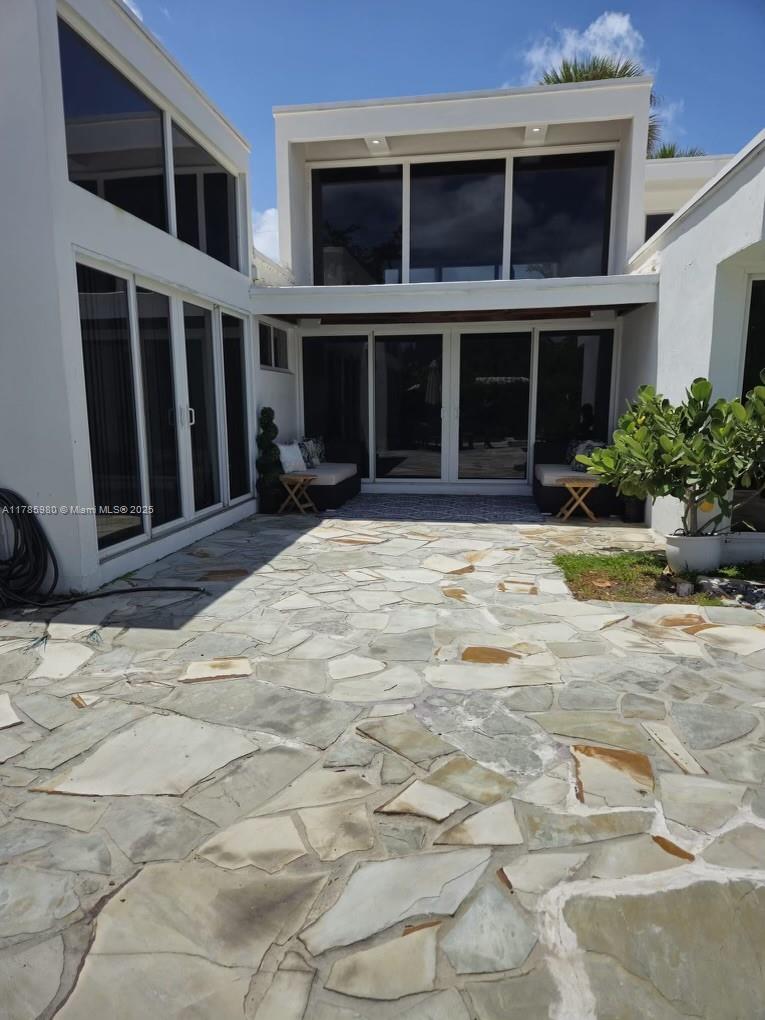 4050 Northeast 25th Avenue Lighthouse Point, FL 33064 - Photo 23 of 35 a view of a brick house with a yard