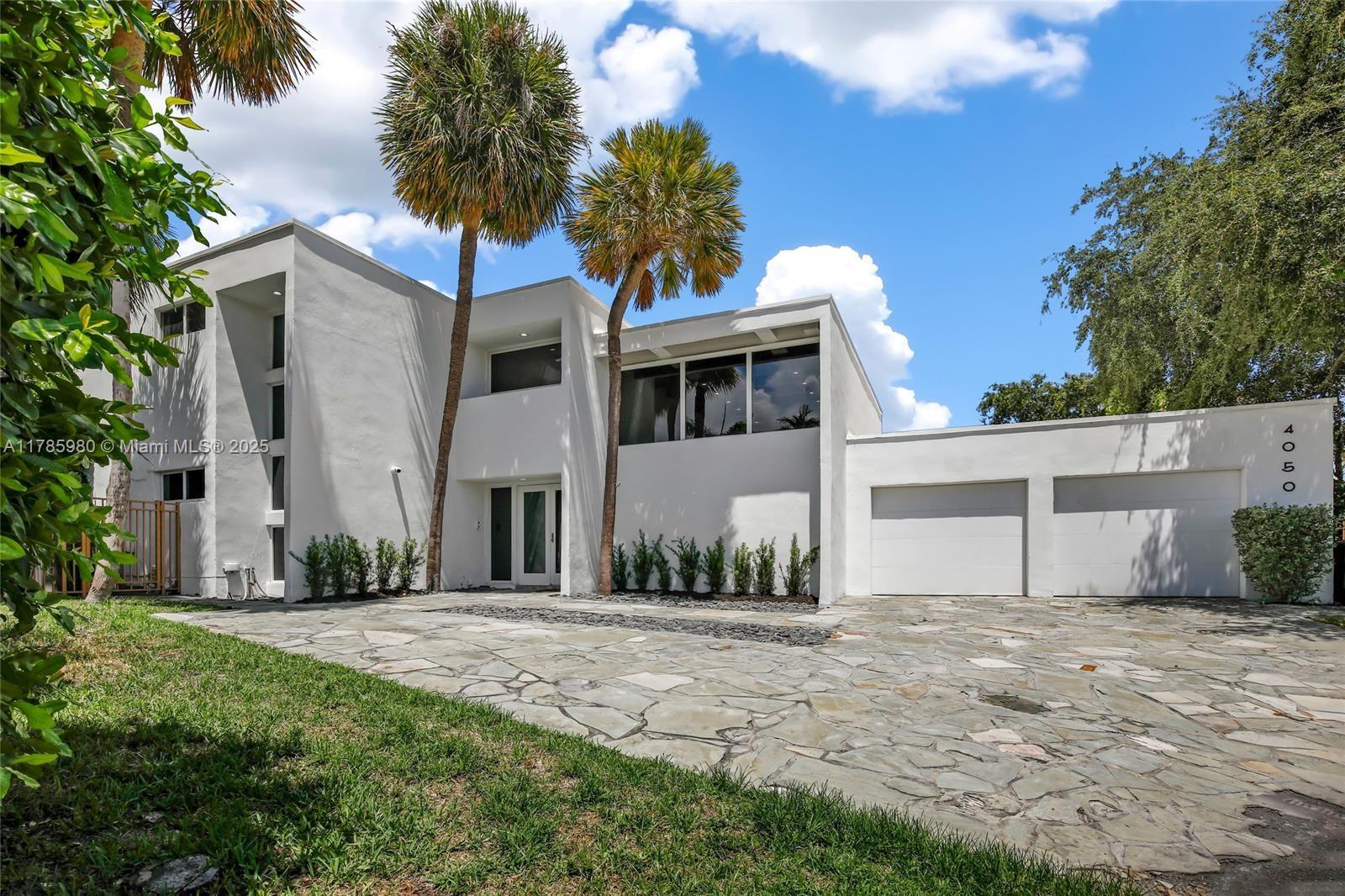 4050 Northeast 25th Avenue Lighthouse Point, FL 33064 - Photo 35 of 35 a front view of a house with a yard
