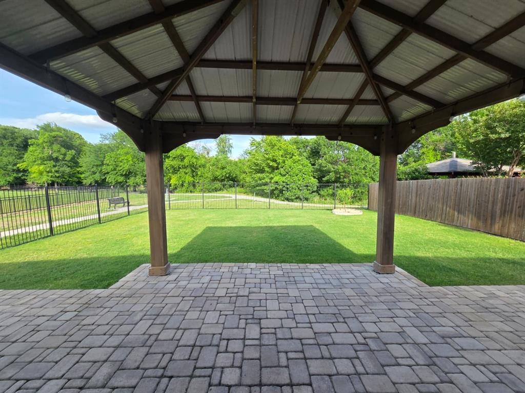1512 Springtree Drive McKinney, TX 75071 - Photo 22 of 23 a view of a porch with a big yard
