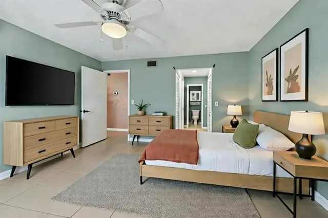 a bedroom with a bed and furniture