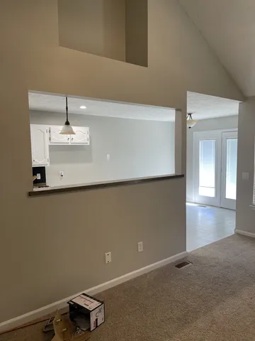 a living room with a fireplace and a window