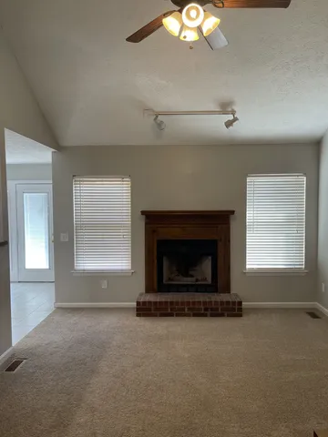 a view of an empty room with a window