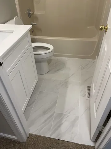 a bathroom with a sink and a toilet