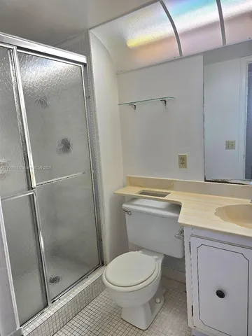 a room with gym equipment and windows