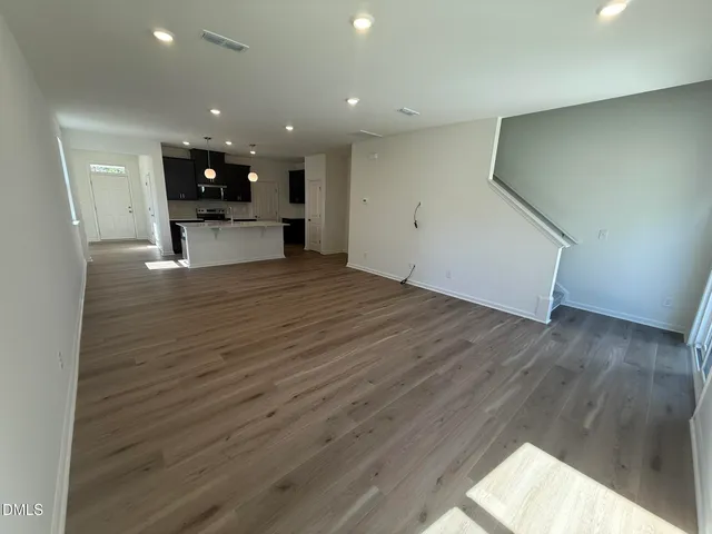 a view of kitchen with utility room and wooden floor