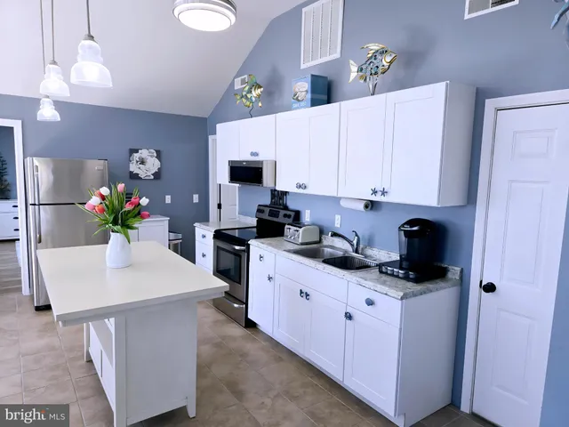 a bathroom with a sink a vanity and a mirror