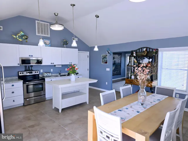 a bedroom with a large bed and a dresser