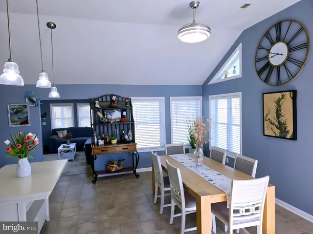 a view of a porch with furniture and garden