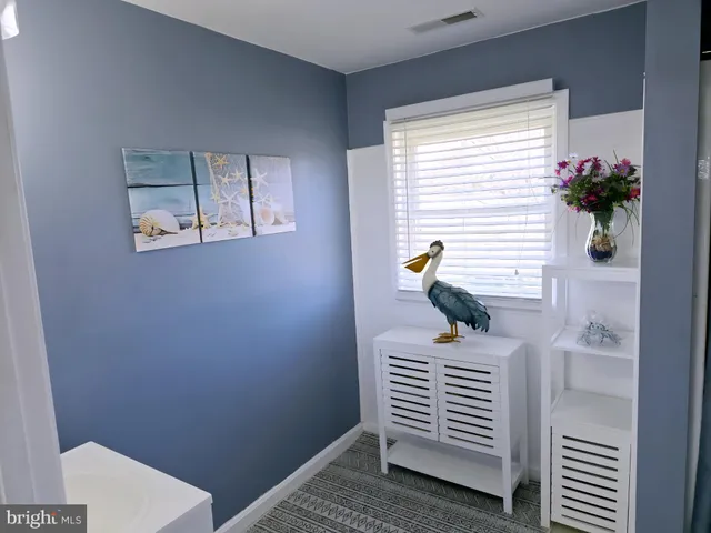 an aerial view of a house with a big yard