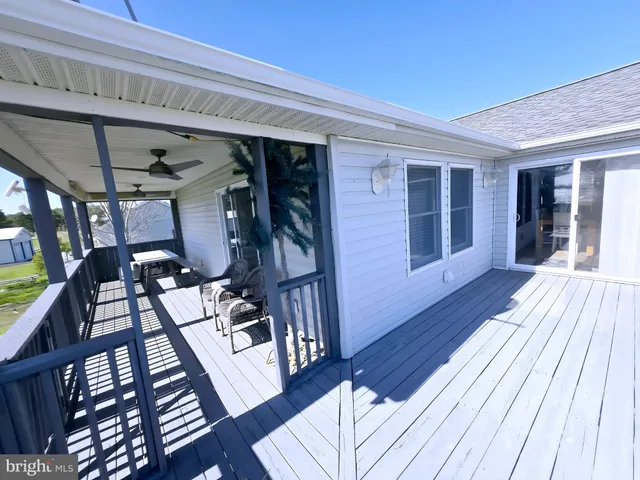 a view of a patio with table and chairs with the potted plants
