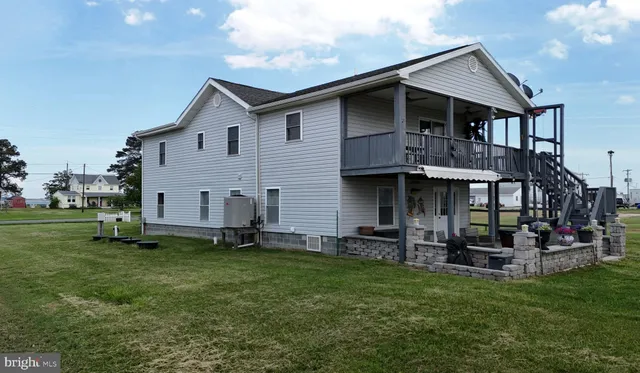 an aerial view of a house with a ocean view